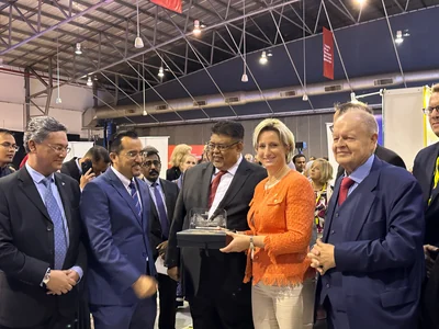 Delegation representatives meeting stakeholders at an exhibition