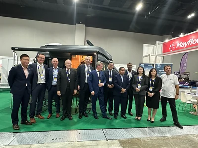 Delegation participants visiting an exhibition stand in Malaysia