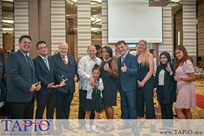 Multi diverse culture having a group photo at hotel ballroom