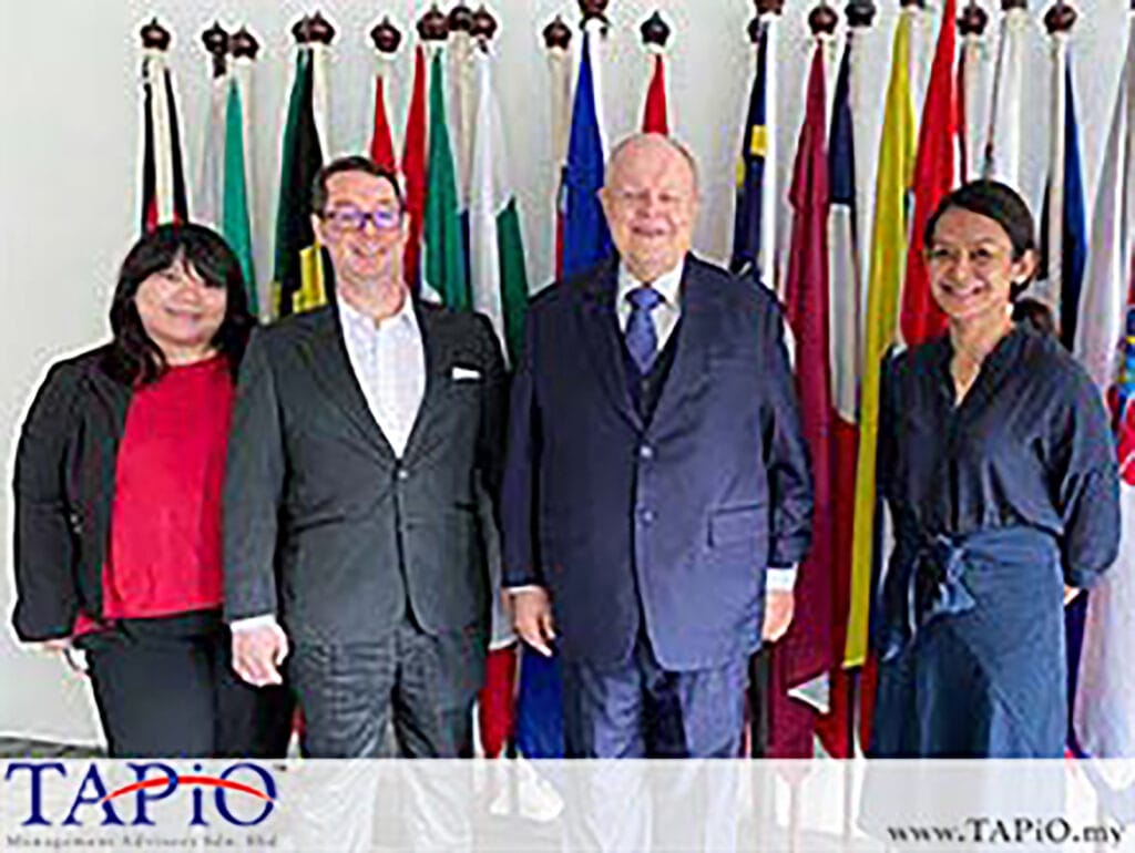 corporate people standing in front of european flags