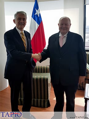 two diplomat standing in front of flag